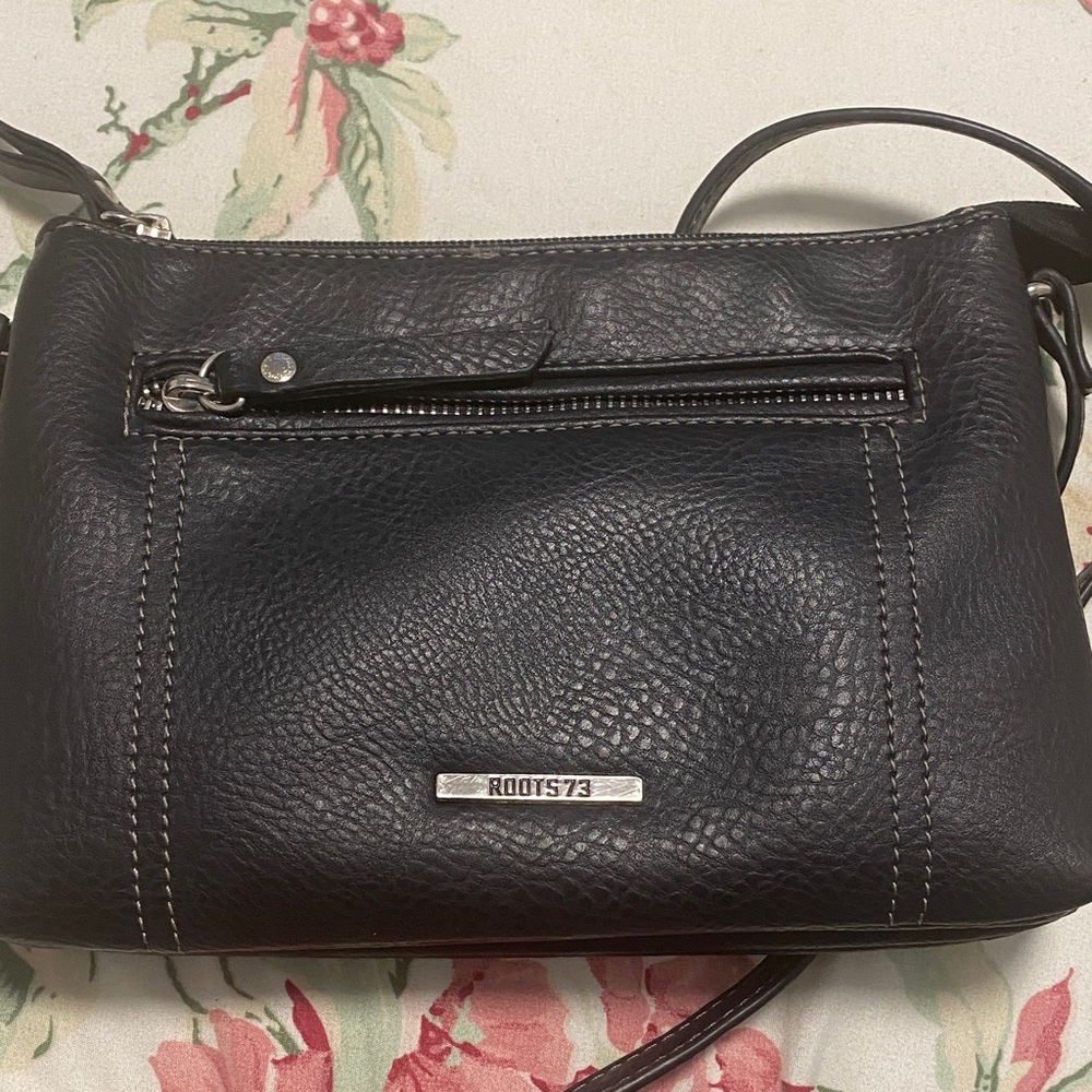 Roots Black Leather Crossbody Bag with Silver Accents